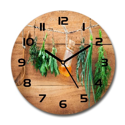 Orologio rotondo con motivo di erbe aromatiche su un filo