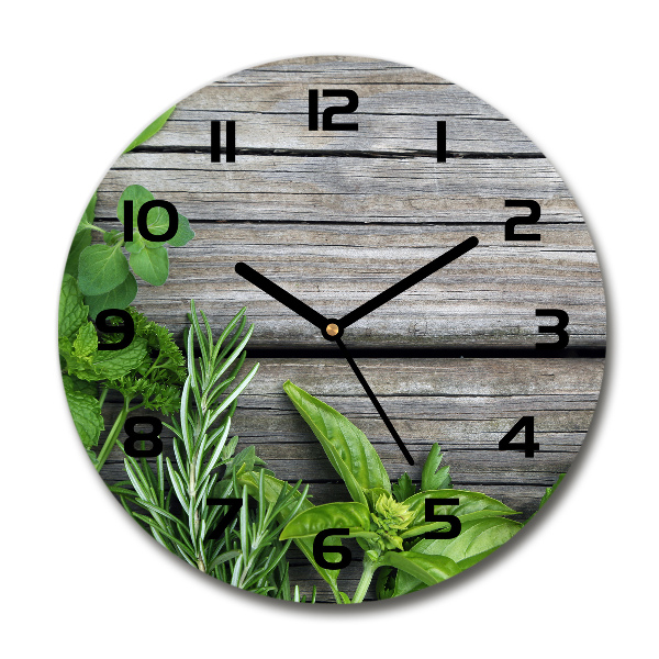 Orologio rotondo con motivo di erbe aromatiche su sfondo in legno