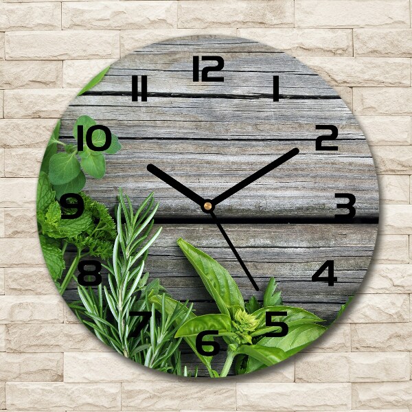 Orologio rotondo con motivo di erbe aromatiche su sfondo in legno