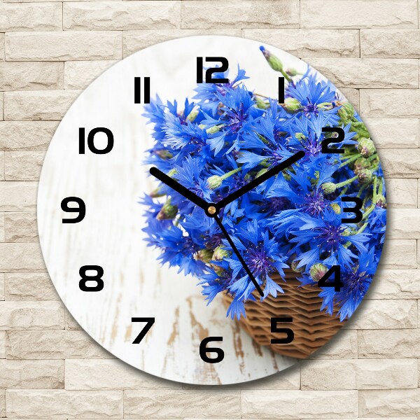 Orologio rotondo in vetro con decorazione di fiordalisi in un cesto