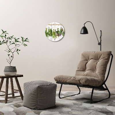 Orologio da parete rotondo con decorazione a erbe aromatiche su un filo