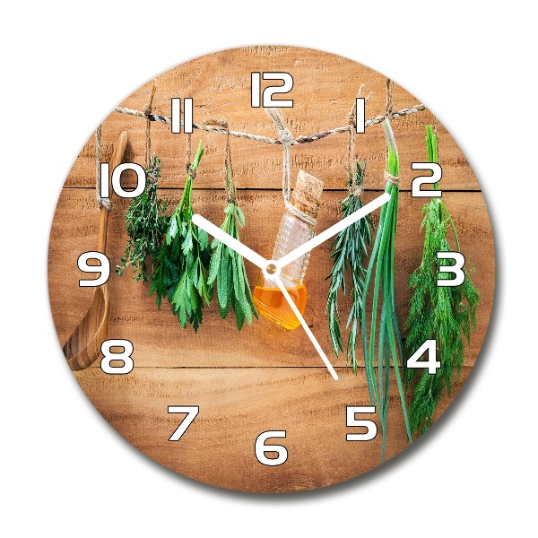 Orologio rotondo con decorazione di erbe aromatiche disposte su un filo