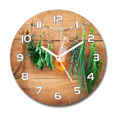 Orologio rotondo con decorazione di erbe aromatiche disposte su un filo