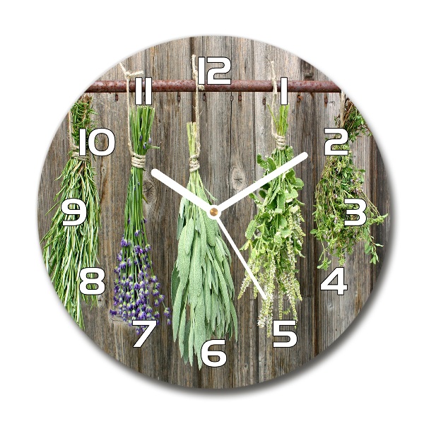 Orologio rotondo in vetro con decorazione di erbe aromatiche su un filo