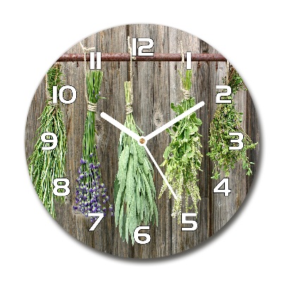 Orologio rotondo in vetro con decorazione di erbe aromatiche su un filo