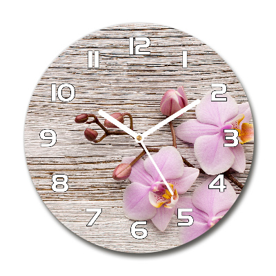 Orologio rotondo in vetro con decorazione a orchidea su supporto in legno