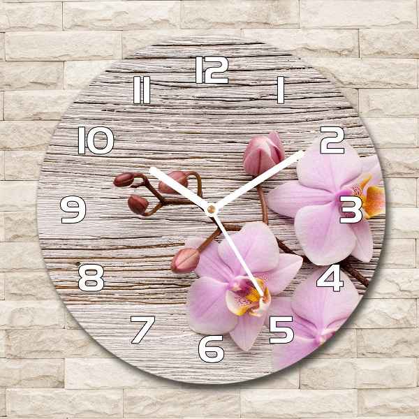 Orologio rotondo in vetro con decorazione a orchidea su supporto in legno