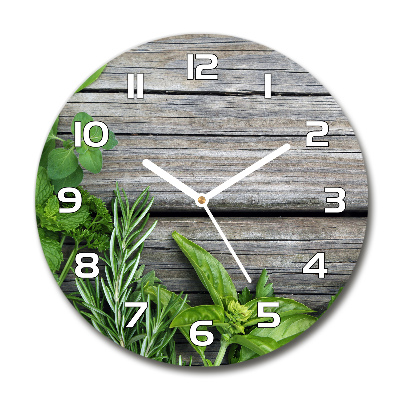 Orologio rotondo con motivo di erbe aromatiche su sfondo in legno