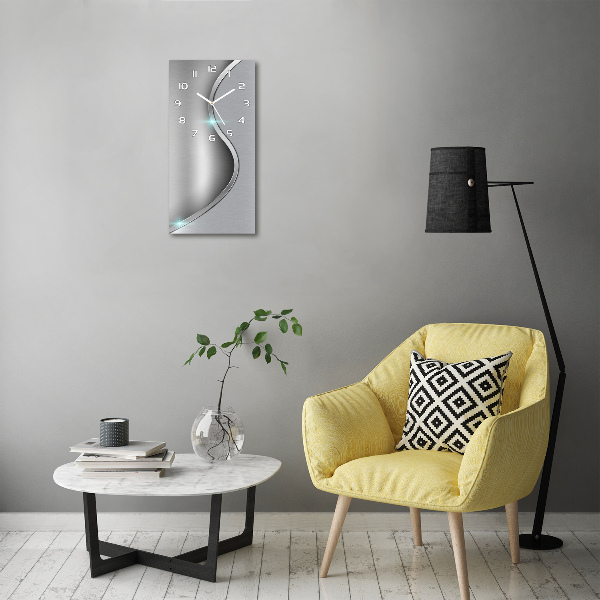 Orologio da parete verticale con motivo astratto in finitura metallica