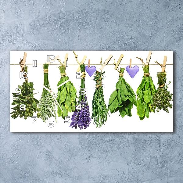Orologio orizzontale con decorazione di erbe aromatiche su un filo