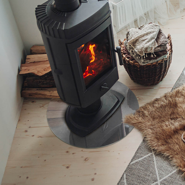 Vetro sotto il camino rotondo con texture effetto cemento