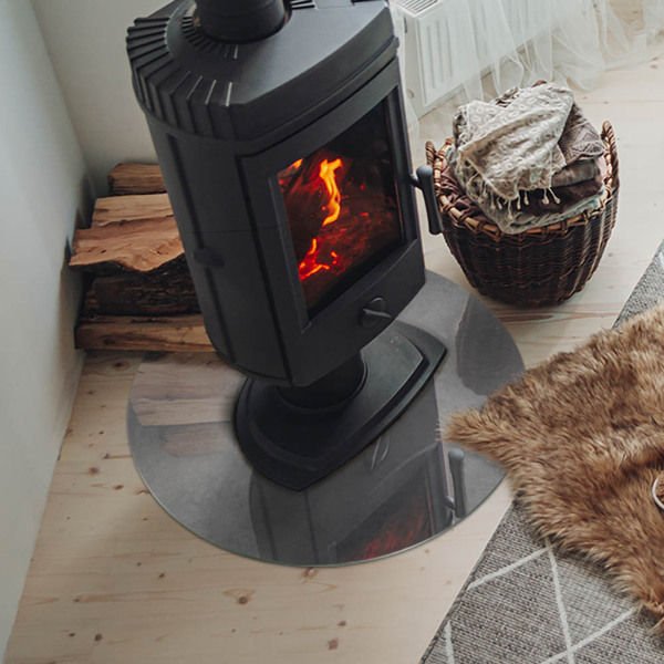 Vetro sotto il camino rotondo con texture effetto cemento