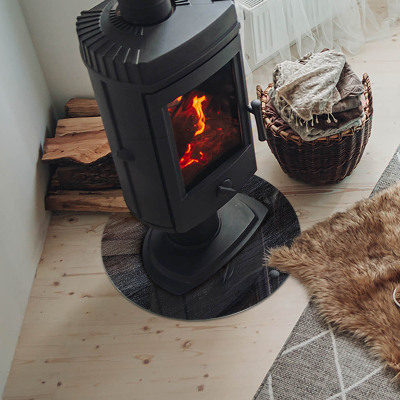 Vetro sotto il camino rotondo con texture effetto pietra sulla superficie