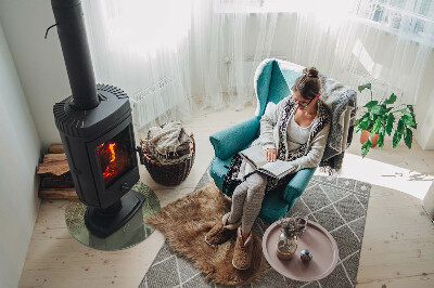 Vetro sotto il camino rotondo con motivo di foglie tropicali sullo sfondo