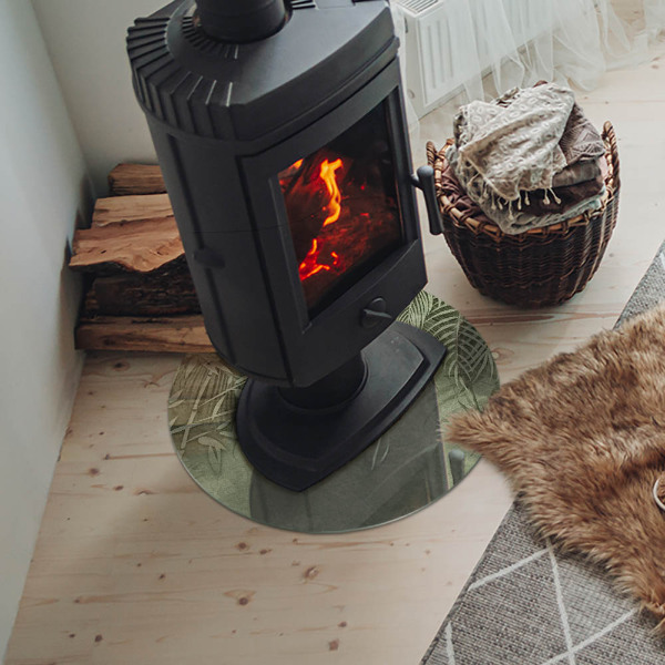 Vetro sotto il camino rotondo con motivo di foglie tropicali sullo sfondo