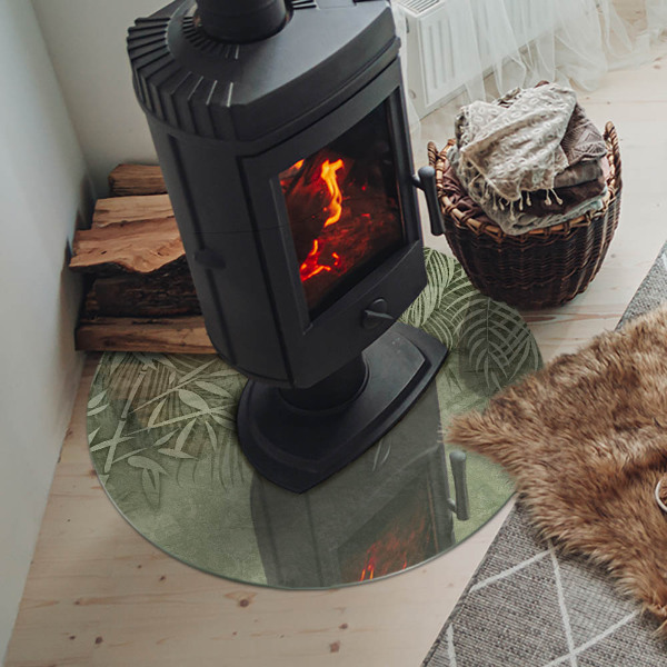 Vetro sotto il camino rotondo con motivo di foglie tropicali sullo sfondo