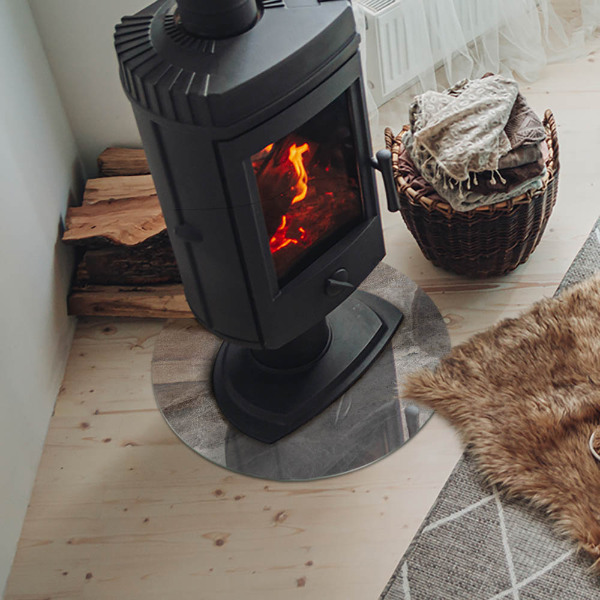 Vetro sotto il camino rotondo con motivo in pietra naturale