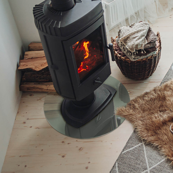 Vetro sotto il camino rotondo in colore grigio-verde