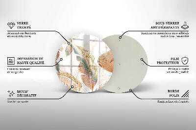 Piatto in vetro per candele con decorazione di piume e foglie in stile boho