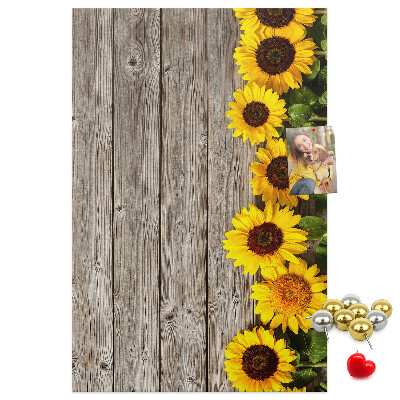 Bacheca in sughero con stampa di girasoli su sfondo in legno