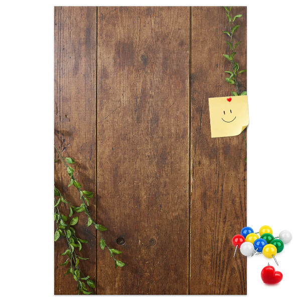 Lavagna in sughero con cornice in legno rustico e rami verdi decorativi