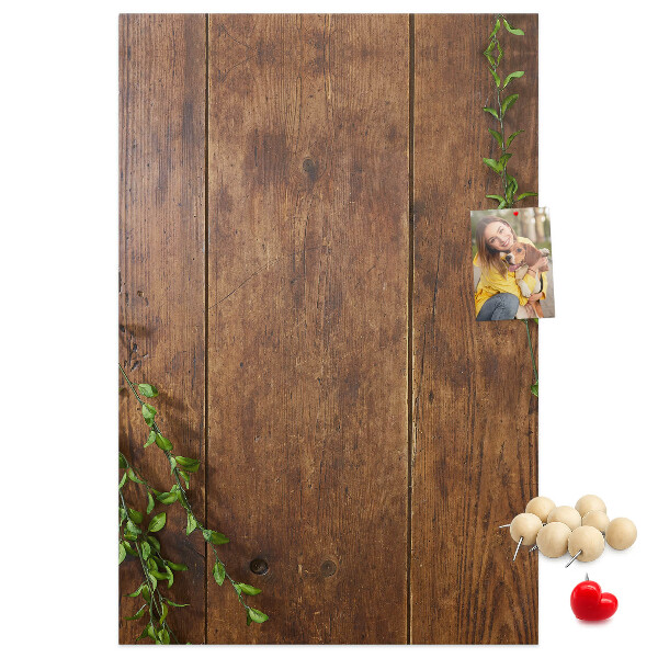 Lavagna in sughero con cornice in legno rustico e rami verdi decorativi