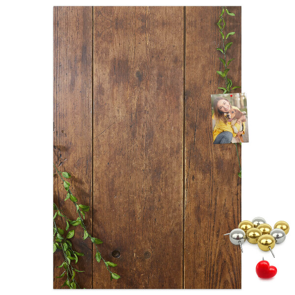 Lavagna in sughero con cornice in legno rustico e rami verdi decorativi