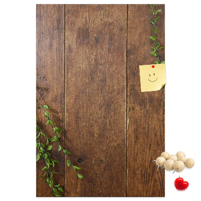 Lavagna in sughero con cornice in legno rustico e rami verdi decorativi