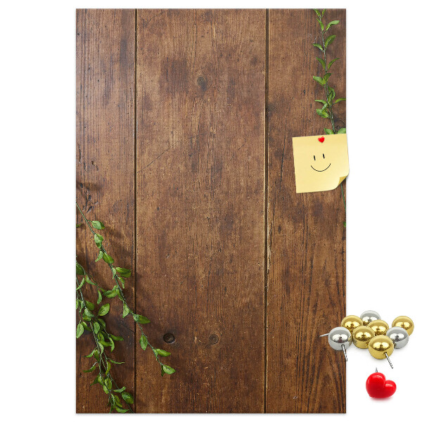 Lavagna in sughero con cornice in legno rustico e rami verdi decorativi