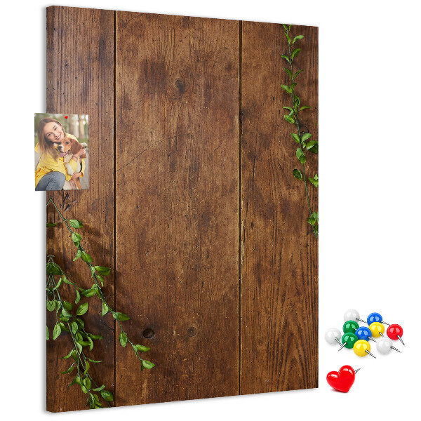 Lavagna in sughero con cornice in legno rustico e rami verdi decorativi