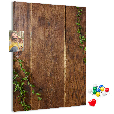 Lavagna in sughero con cornice in legno rustico e rami verdi decorativi