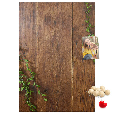 Lavagna in sughero con cornice in legno rustico e rami verdi decorativi