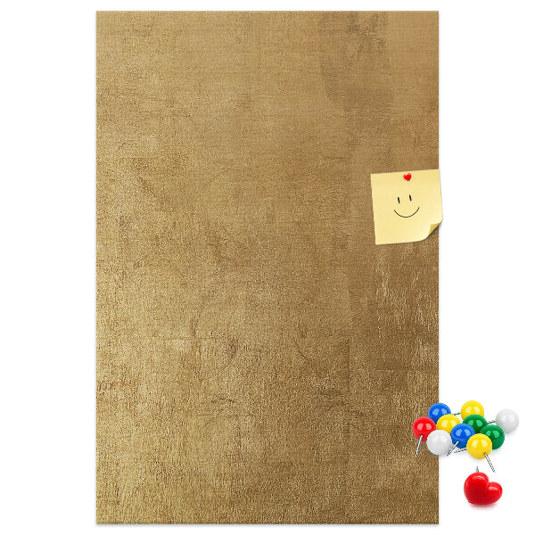 Bacheca di sughero con carta dorata e spilli colorati