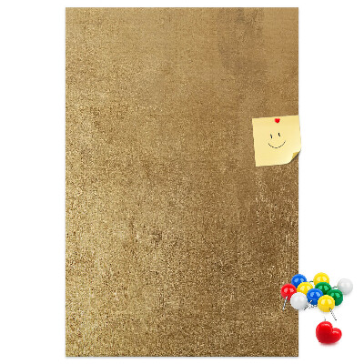 Bacheca di sughero con carta dorata e spilli colorati