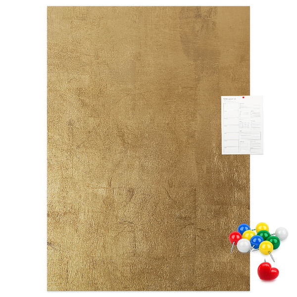 Bacheca di sughero con carta dorata e spilli colorati