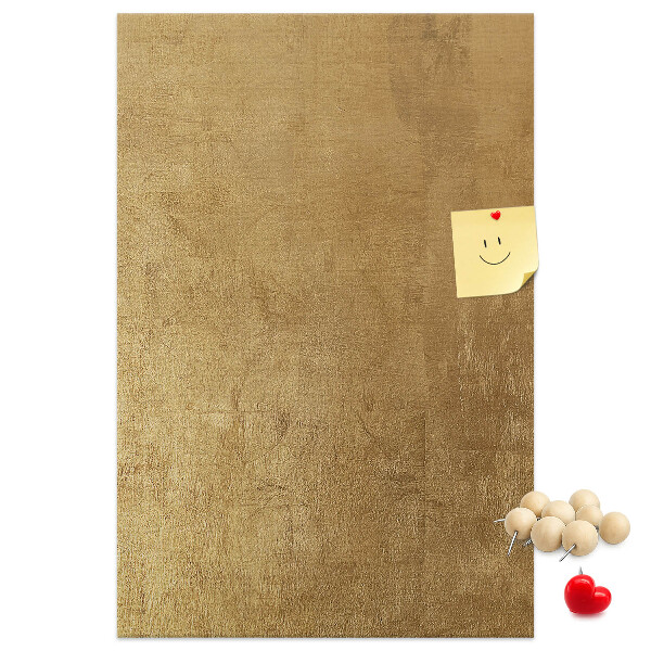Bacheca di sughero con carta dorata e spilli colorati