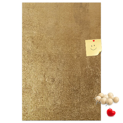 Bacheca di sughero con carta dorata e spilli colorati