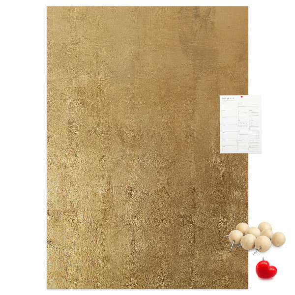 Bacheca di sughero con carta dorata e spilli colorati