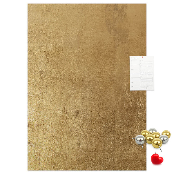 Bacheca di sughero con carta dorata e spilli colorati