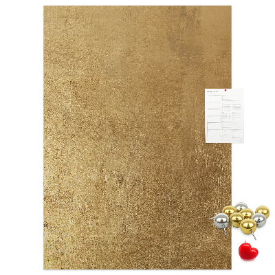 Bacheca di sughero con carta dorata e spilli colorati