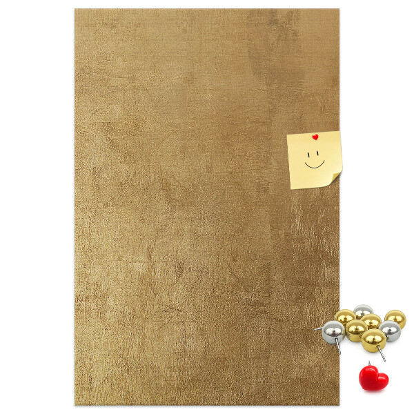 Bacheca di sughero con carta dorata e spilli colorati
