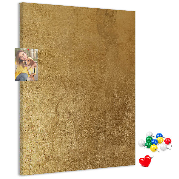 Bacheca di sughero con carta dorata e spilli colorati