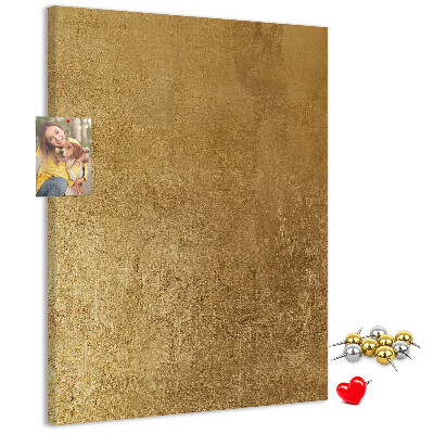 Bacheca di sughero con carta dorata e spilli colorati