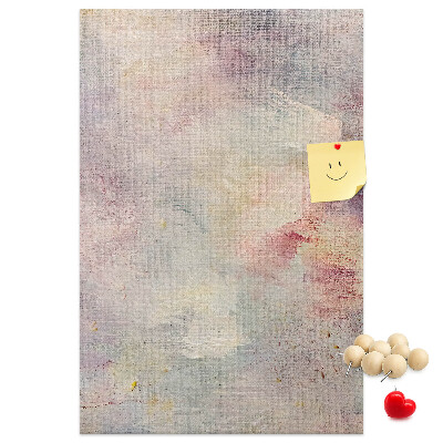 Lavagna in sughero con delicati puntini color pastello sullo sfondo