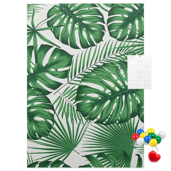 Bacheca di sughero con stampa di foglie di Monstera su sfondo chiaro