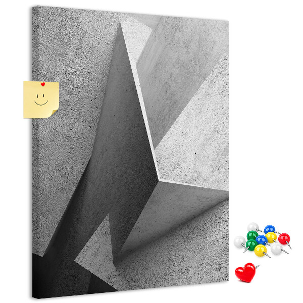 Bacheca di sughero con geometrie concrete in diverse tonalità di grigio