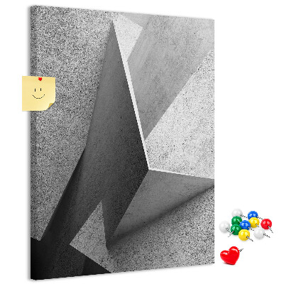 Bacheca di sughero con geometrie concrete in diverse tonalità di grigio