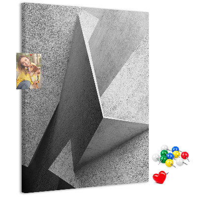 Bacheca di sughero con geometrie concrete in diverse tonalità di grigio