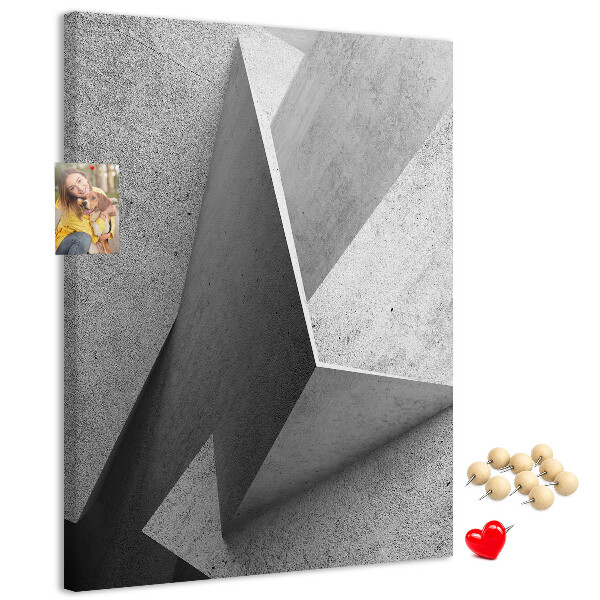 Bacheca di sughero con geometrie concrete in diverse tonalità di grigio