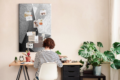 Bacheca di sughero con geometrie concrete in diverse tonalità di grigio
